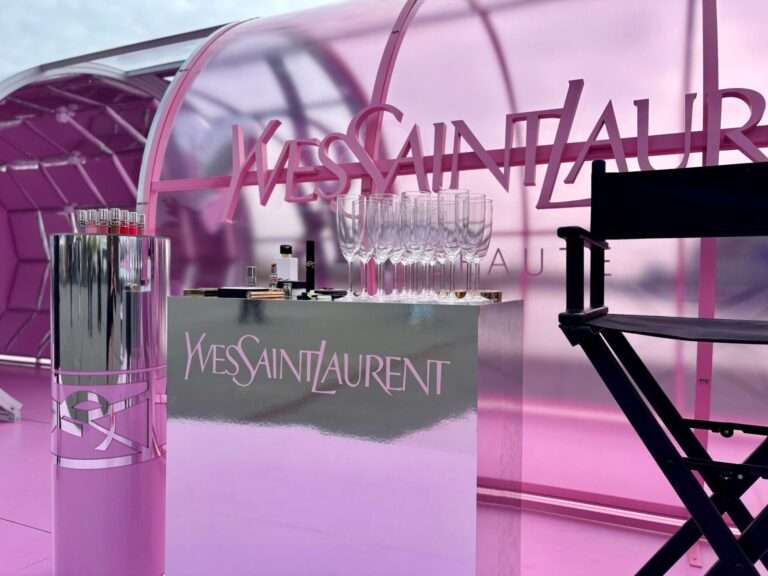 Yves Saint Laurent branded pink modular archway and display built with T3 Systems components.