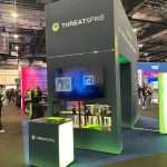 ThreatSpike sustainable exhibition stand built with the T3 System featuring illuminated archway, modular framework and branded graphics