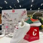 Product presentation using T3 acrylic shelving and branded graphics at PGA Show booth