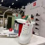 Duca del Cosma shoe display on counter within white T3 Deco exhibition stand