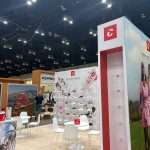 Branded vertical display and counter element within Duca del Cosma PGA Show stand